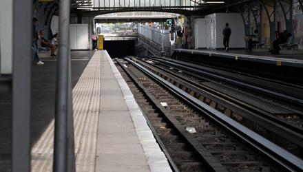 Digital Beings on a train station in Paris looking to the future